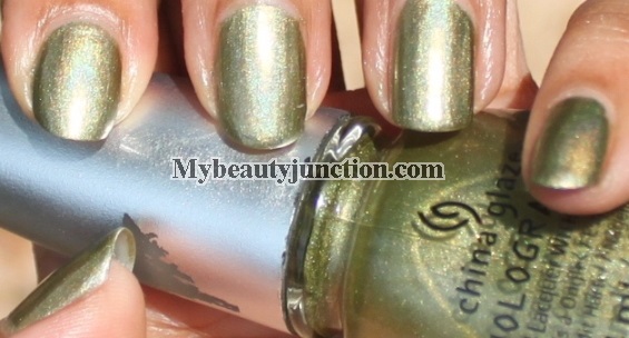 St Patrick's Day green shamrock nail art with China Glaze OMG It's A UFO polish and O.P.I. Greenwich Village